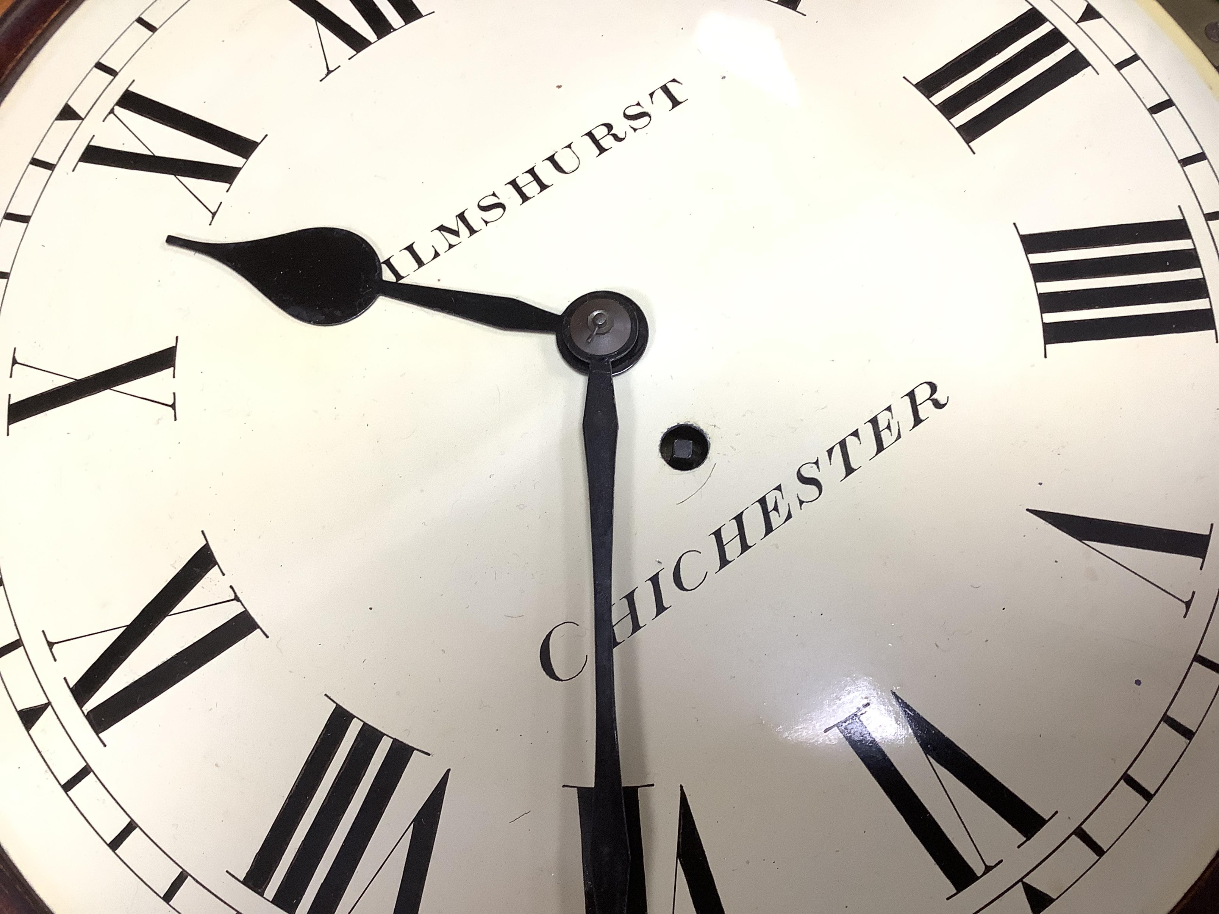A circular dial mahogany cased wall clock with a single train fusee movement, painted dial reading Wilmshurst, Chichester, 39cm in diameter